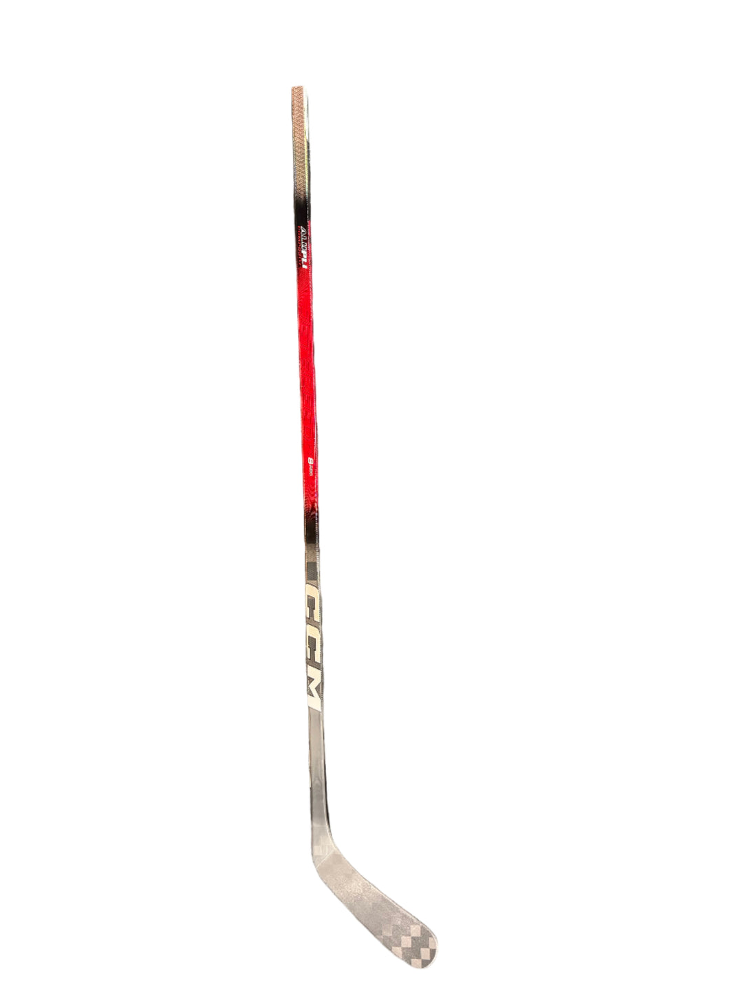 Hockey stick with CCM branding on a gray surface