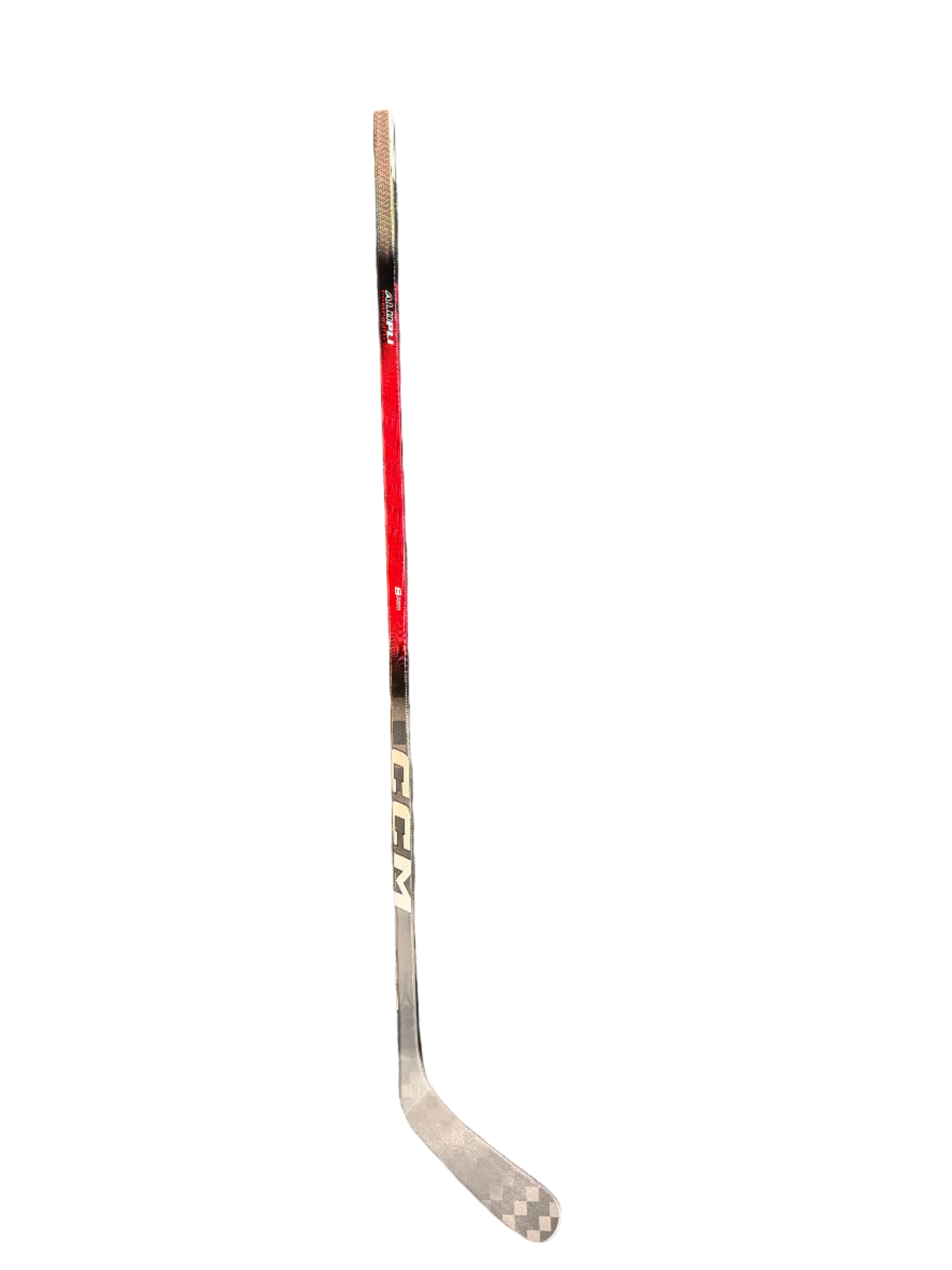 Hockey stick with CCM branding on a gray surface
